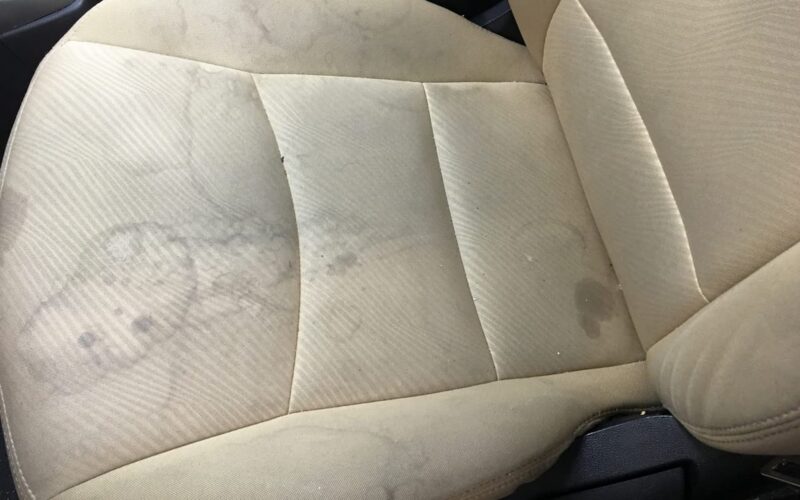 stains on the fabric upholstery of a car seat