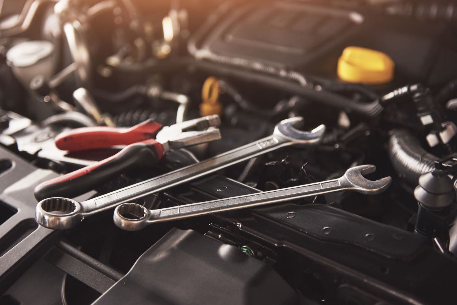 Close up of tools near car engine