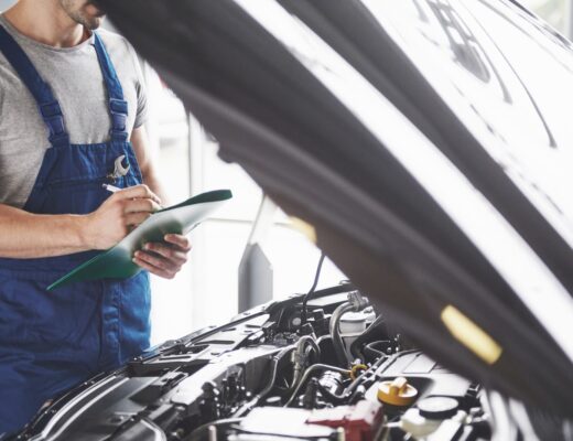 Man checking car engine