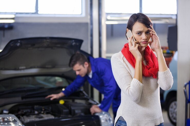 Customer in Auto Servis Talking by Phone