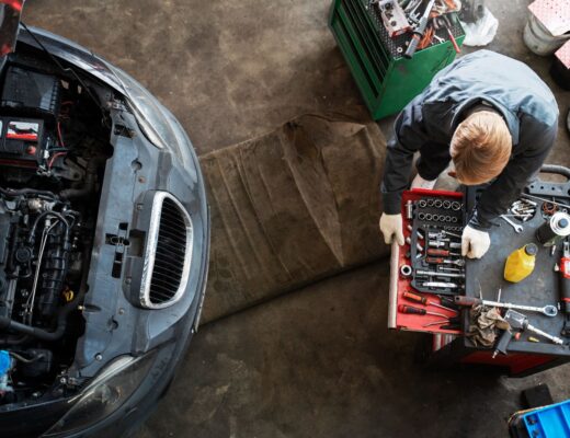 Top view of man repairing car
