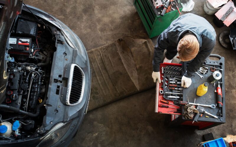 Top view of man repairing car